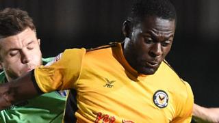 Frank Nouble of Newport County is tackled by Doug Loft of Colchester United