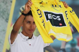 Colombia's Egan Bernal shows the yellow jersey that accredits him as champion of the Tour de France