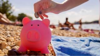 Piggy bank on a beach