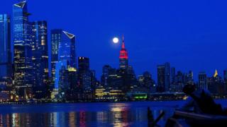 The Supermoon rises behind the Empire State Building - 7 April 2020