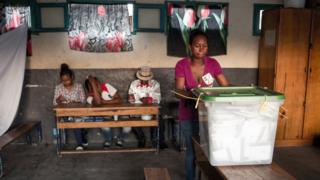 Polling official wait for voters at a polling station of Isotry district in Antananarivo.