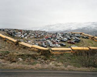 Cars and buses in a junkyard
