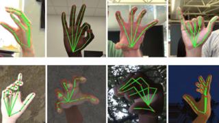Graphs are mapped over pictures of hands