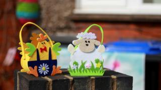 Easter decorations displayed on a wall in Northampton