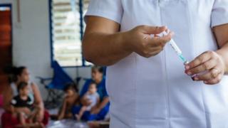 A nurse at work giving vaccines in Samoa