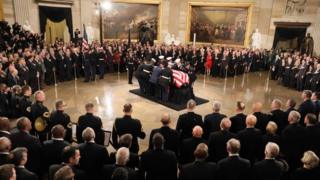 President George HW Bush lies in state at the US Capitol
