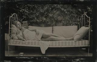 Woman reading on a kindle