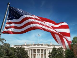 American flag in front of the White House in Washington D.C.