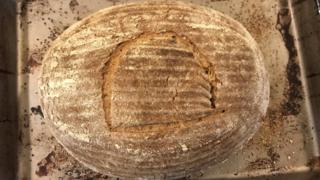 Baked loaf scored with hieroglyph meaning "bread"