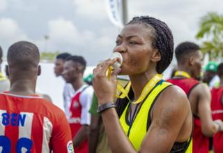 Woman kissing the medal