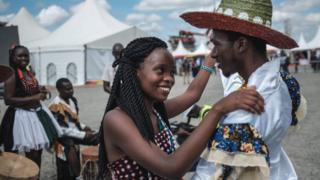 A Kenyan couple dance at the construction site of Standard Gauge Railway (SGR) in Nairobi, Kenya - Saturday 23 June 2018
