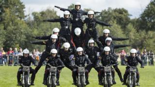 white helmet riders perform