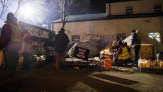 Minneapolis protesters gather outside police precinct after Jamar Clark shooting.