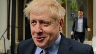 Boris Johnson leaving his London home on Tuesday