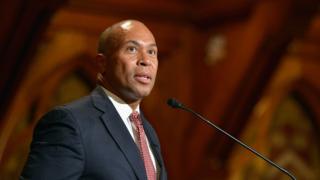 Deval Patrick stands at a podium