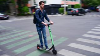 A man riding a scooter in Mexico City