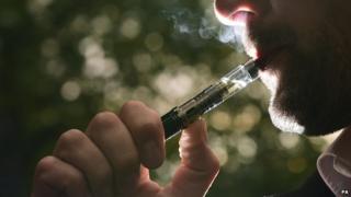 A man smoking an electronic cigarette