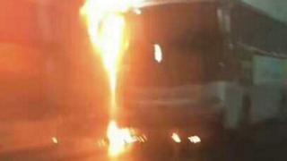 Photo taken with a smartphone shows school bus on fire in Taojiakuang tunnel, Weihai, Shandong Province, China. 9 May 2017