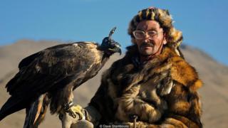 Blindfolds are placed over eagles' eyes to keep them calm