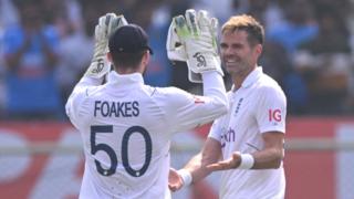 England's Ben Foakes (left) and James Anderson (right) celebrate a wicket