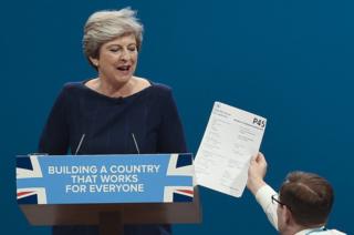 Prime minister Theresa May is handed a P45