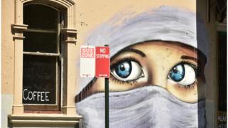 A mural showing the eyes of a Muslim woman wearing a headscarf, painted on a wall in an inner city suburb of Sydney (October 2, 2014)