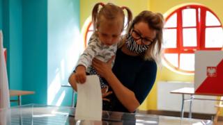 A woman voting in Warsaw - 12 July