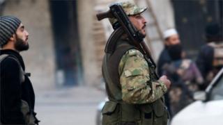 Free Syrian Army fighters gather in a rebel-held area of Aleppo, Syria December 12, 2016.