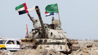 UAE and Saudi flags on a tank as UAE troops take part in operations against Houthi rebels in the southern port city of Yemen, 8 August 2015