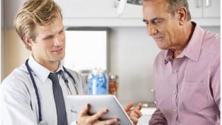 doctor with patient discussing results