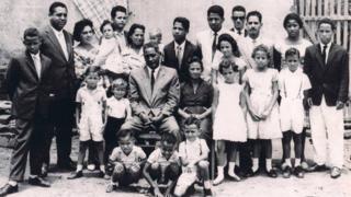 Vania Nascimento's family gather for a photograph