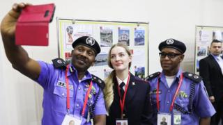 Nigeria's and Russia's law enforcement officers take a selfie at the opening of the Centre for International Police Cooperation; the Centre is to be in operation during the 2018 FIFA World Cup.