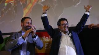Spain's far-right VOX party leader Santiago Abascal and regional candidate Francisco Serrano celebrate results after the Andalusian regional elections in Seville