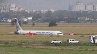 A Ural Airlines A-321 passenger plane is seen oon the site of its emergency landing in a field outside Zhukovsky airport in Ramensky district of Moscow region, Russia.