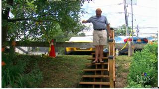 Adi Astl on the stairs he built in a Toronto park