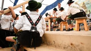 Children watch competitors face off in the German Finger Wrestling (Fingerhakeln) Championships in Garmisch-Partenkirchen, southern Germany, 15 August 2019
