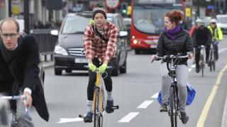 People cycling on a road