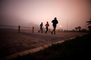 Joggers in the mist