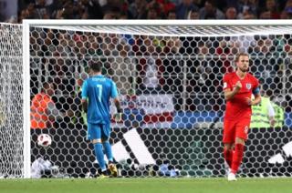 Kane pumps his fist after scoring a penalty past Colombia keeper David Ospina.
