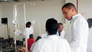 Doctors care for patients affected by Cholera at the Heroes stadium temporary transformed in a hospital on January 15, 2018 in Lusaka, Zambia
