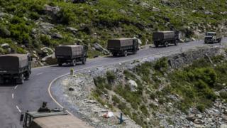 An Indian army convoy drives towards Leh, on a highway bordering China, 19 June 2020
