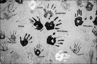 Hand prints of children who have been treated at the Chingari Trust physical therapy clinic