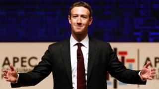 Mark Zuckerberg gestures while addressing the audience during a meeting of the APEC (Asia-Pacific Economic Cooperation) CEO Summit in Lima, Peru, November 19, 2016.