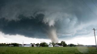A tornado rips through a residential area after touching down south of Wynnewood, Oklahoma