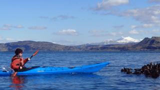 Laura Duncan kayaking off Innish Island