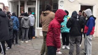 Queue at shoe shop