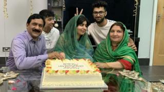 Malala celebrating graduation with family