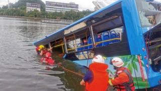 Rescuers at the site of the bus crash