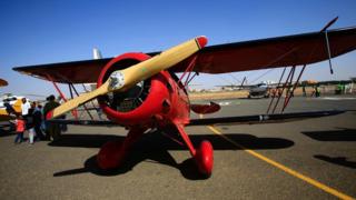 A Waco YMF-5D biplane sits on the runway on November 20, 2016 in Khartoum airport during the Vintage Air Rally (VAR).