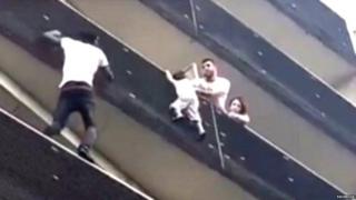 Mamoudou Gassama scales building to rescue child. 27 May 2018